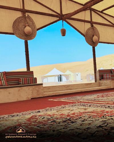 a view of the desert from the inside of a tent at Al Salam Desert Camp Bidiya in Bidiyah