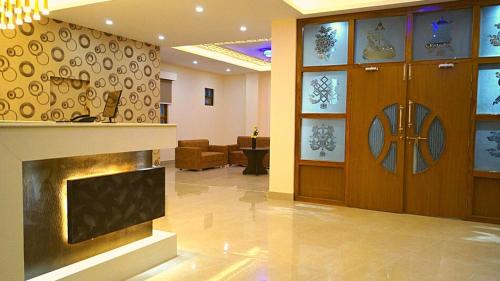 a lobby with a fireplace in a building at The Staynest Yeasel 4 STAR LUXURY RESRT in Gangtok