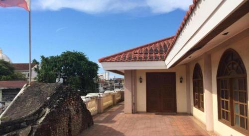 a building with a door and a brick walkway at The Premiere Business Hotel in Kalibo