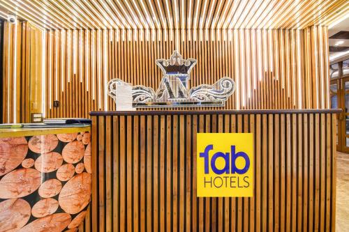 a sign for the ibid huts in a building at FabHotel Aafreen International in Kolkata