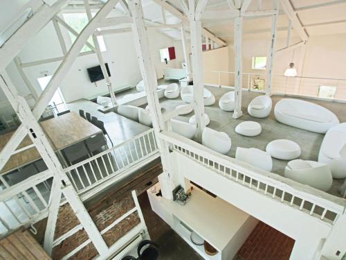 an overhead view of a living room with white furniture at Mountain Retreat for Group in Daverdisse