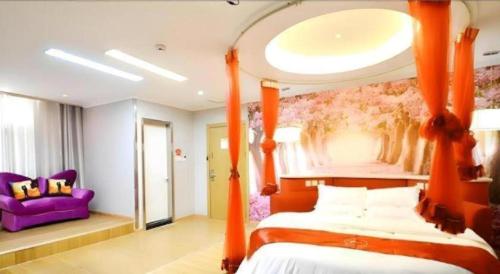 a bedroom with an orange canopy bed and a purple couch at Thank Inn Hotel He'nan Xuchang Railway Station Qiyi Road Caowei Ancient Town in Xuchang