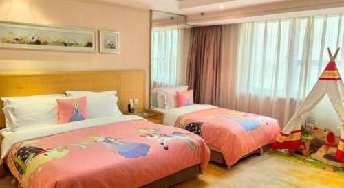 a bedroom with two beds and a toy tent at Ramada Plaza Shenyang Citycenter in Shenyang