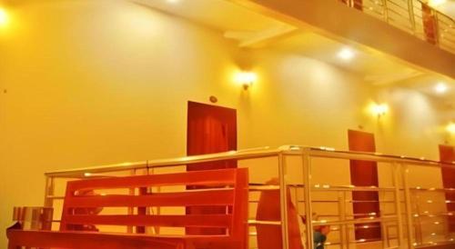 a room with a staircase and a glass railing at 107 Tower Hotel Nan in Nan