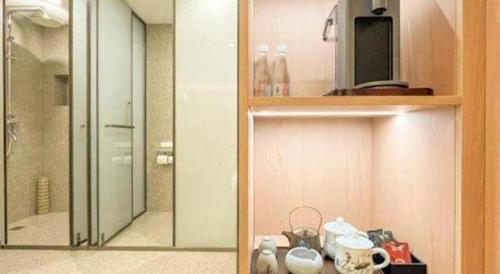 a medicine cabinet with a mirror in a bathroom at Huangshan Yupinglou Hotel in Huangshan