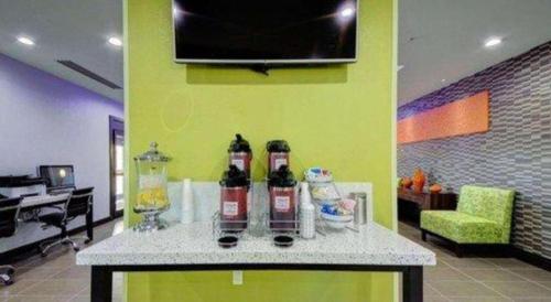 a room with a table with two bottles on it at Comfort Inn & Suites Tulsa I-44 West - Rt 66 in Tulsa