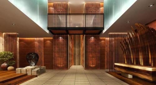 a lobby with a bench and a glass ceiling at AOLUGUYA in Harbin