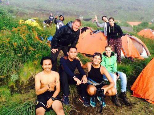 a group of people posing in front of their tents at Jeges Homestay in Senggigi 