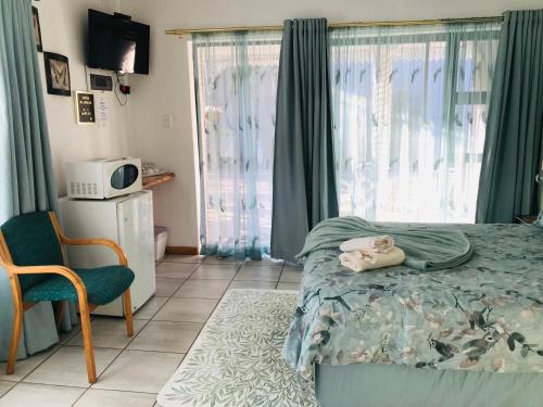 Ένα ή περισσότερα κρεβάτια σε δωμάτιο στο Sondela Bed and Breakfast
