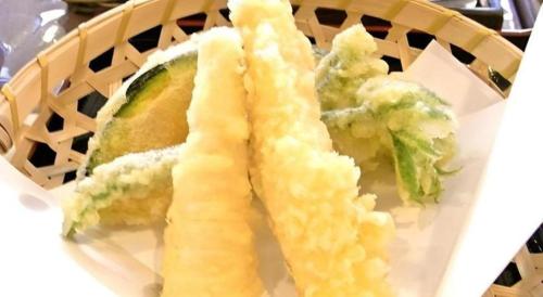 a plate of food with a sandwich and lettuce at Espoir Misawa in Hakuba