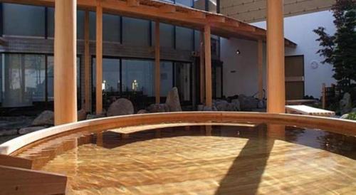 a swimming pool in the middle of a house at Hadano Yugawara Onsen Manyo no Yu in Hadano