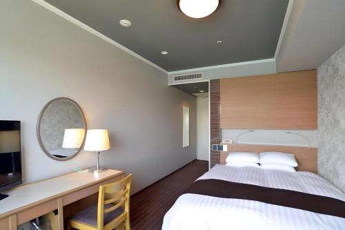 Green Hill Hotel Onomichiにあるベッド