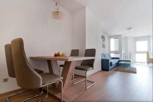 a dining room table and chairs in a room at cosy apartment in perfect location in Vienna