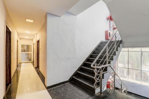 a staircase in a building with a stair case at FabExpress Travellers in Lucknow