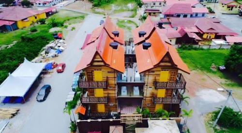 an overhead view of a house with an orange roof at Kampong Pinang Sebatang Melaka in Melaka