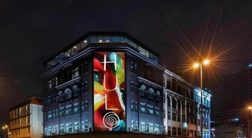 a building with a painting on the side of it at The Hulo Hotel & Gallery in Kuala Lumpur