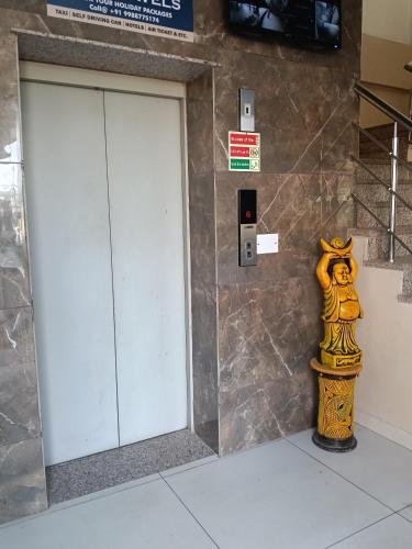 a fire hydrant next to a door in a building at Hotel orbit grand in Chandīgarh