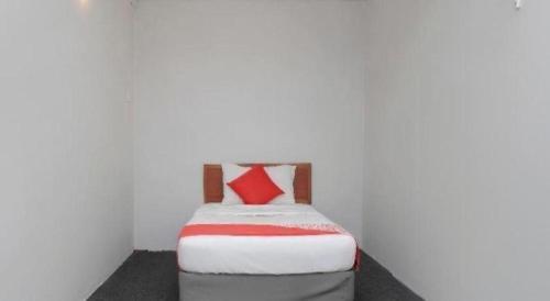 Katil atau katil-katil dalam bilik di OYO 90120 MI Hotel Dungun