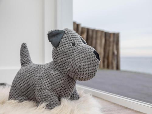 a stuffed dog toy sitting in front of a mirror at Unique apartment, located on the Oosterschelde and marina of Sint Annaland in Sint Annaland