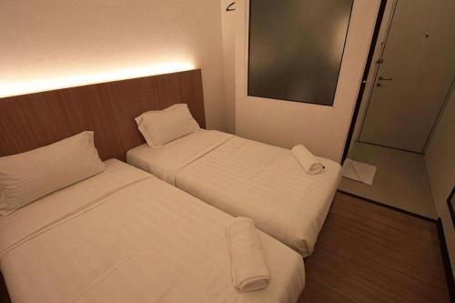 Katil atau katil-katil dalam bilik di Place2stay @ Campus Hub