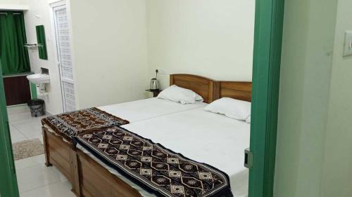 Ένα ή περισσότερα κρεβάτια σε δωμάτιο στο Hotel O New Nest