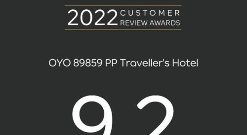 a sign that says supreme review awards with two numbers at OYO 89859 PP Traveller's Hotel in Pasir Puteh
