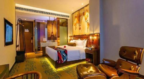 a hotel room with a bed and a living room at James Joyce Coffetel Chengdou Wuqing Wanda Plaza in Chengdu