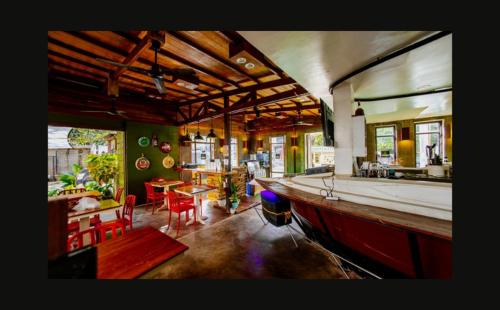 a large living room with a large boat in it at Corner Crib El Nido Hostel in El Nido