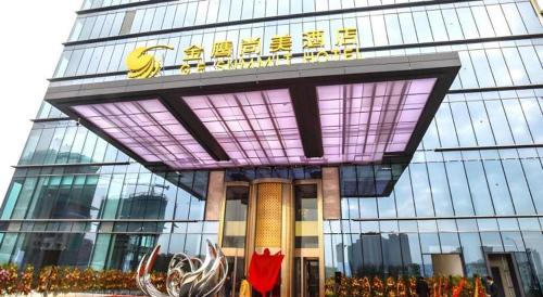 a building with a sign on the front of it at Golden Eagle Summit Hotel Kunshan in Suzhou