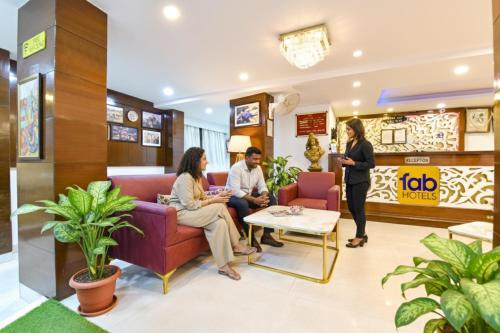 a group of people sitting in a waiting room at FabHotel Sikka Royal Classic - Mall road in Mussoorie