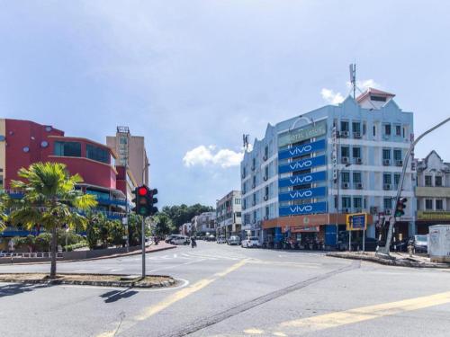 a city street with a traffic light and a building at OYO 175 Lotus Hotel in Kuala Lumpur