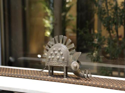 a small metal armour sitting on a window sill at Hotel Sunoak Kashiwanoha in Kashiwa