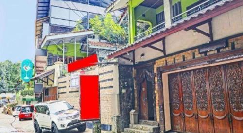 a white truck parked in front of a building at OYO Life 92127 Skyland Pasteur in Bandung