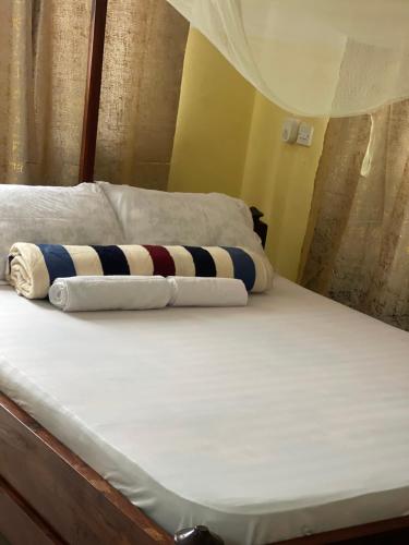 Ένα ή περισσότερα κρεβάτια σε δωμάτιο στο Epic Malaika