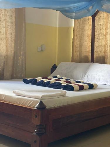 Ένα ή περισσότερα κρεβάτια σε δωμάτιο στο Epic Malaika