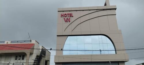 a building with a hotel wa sign on it at Hotel VN in Bhavnagar