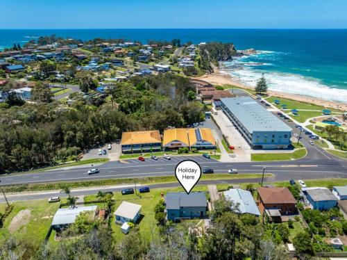 an aerial view of a town with a street and a road at Skyes Beach House-Views, Spas, Sauna, Arcade Games in Surf Beach