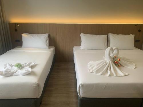 Postel nebo postele na pokoji v ubytování S2S Queen Trang Hotel