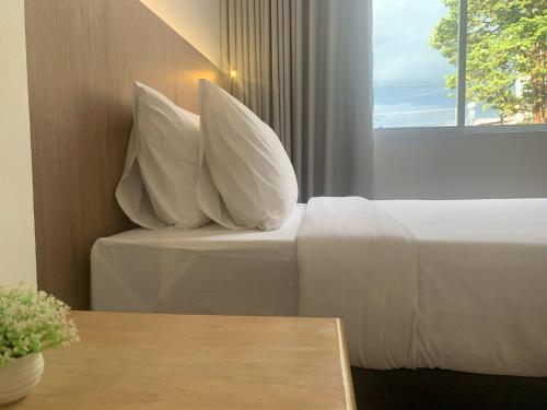 Postel nebo postele na pokoji v ubytování S2S Queen Trang Hotel