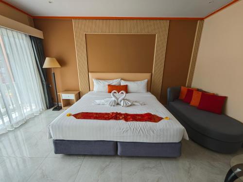 Ένα ή περισσότερα κρεβάτια σε δωμάτιο στο Chabana Kamala Hotel