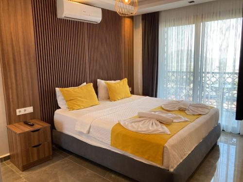 Ένα ή περισσότερα κρεβάτια σε δωμάτιο στο Tasar Villa 1