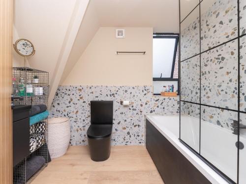 a bathroom with a sink and a toilet in a room at Pass the Keys Stunning home with private parking in Bath in Bath