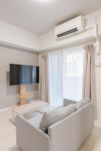 Μια τηλεόραση ή/και κέντρο ψυχαγωγίας στο Ekimae apartment