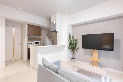Η κουζίνα ή μικρή κουζίνα στο Ekimae apartment
