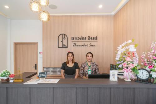 two women standing at a counter in a salon at Thawalai Inn, Kata Beach in Kata Beach