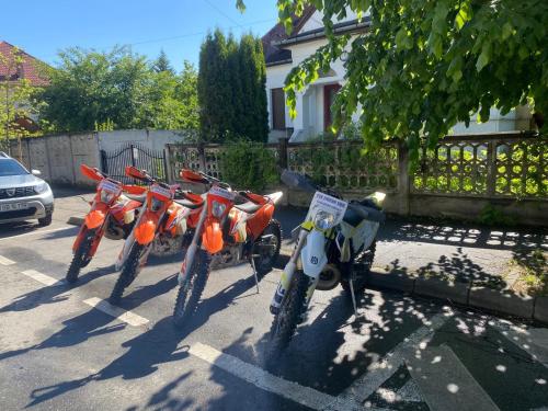 a row of motorcycles parked in a parking lot at Hotel Gallant Sibiu in Sibiu