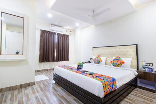 Ένα ή περισσότερα κρεβάτια σε δωμάτιο στο FabHotel The Sky