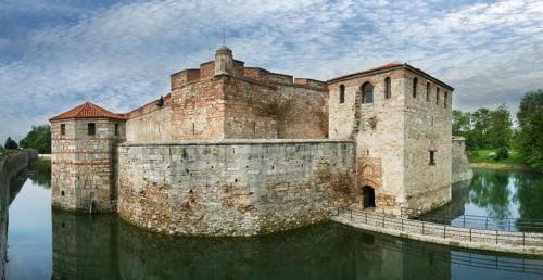 a large building in the middle of a body of water at River Garden House in Vidin