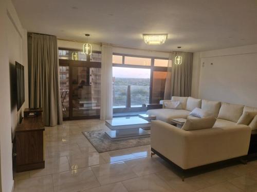 Khu vực ghế ngồi tại Almasi Suites at Sandyshore Beach Resort