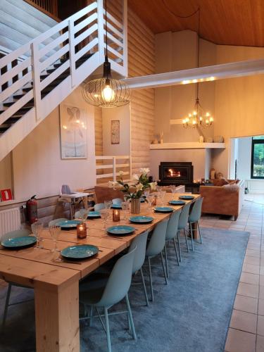 a long wooden table and chairs in a room at Gite de Liresse 